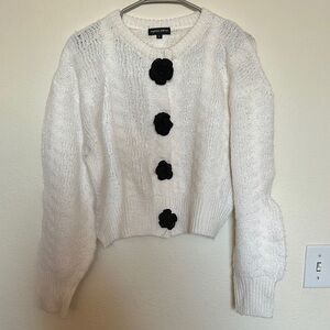 Cozy White Sweater with Black Floral Buttons
